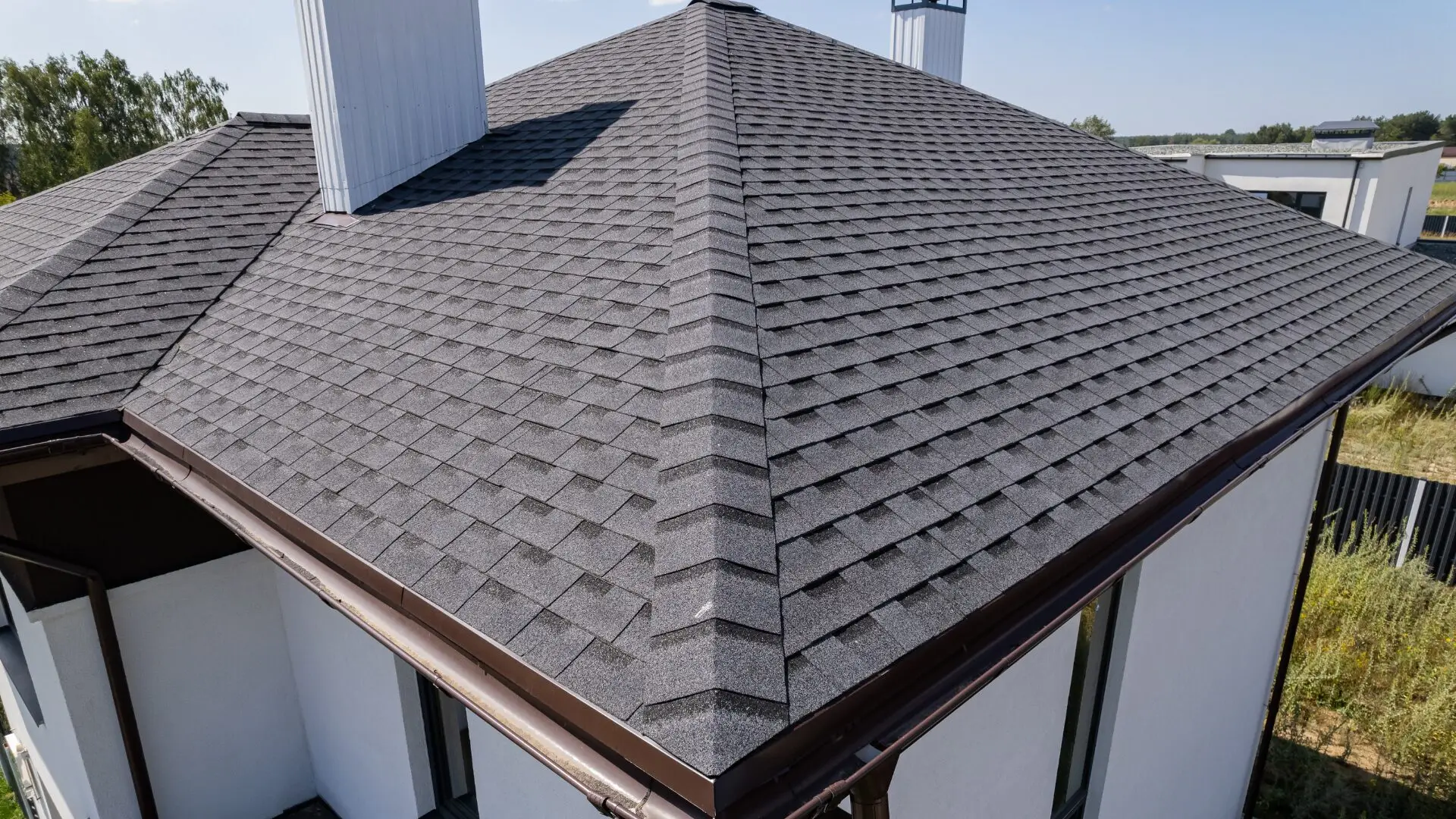Professional roof installation with carefully aligned shingles and durable weather-resistant materials