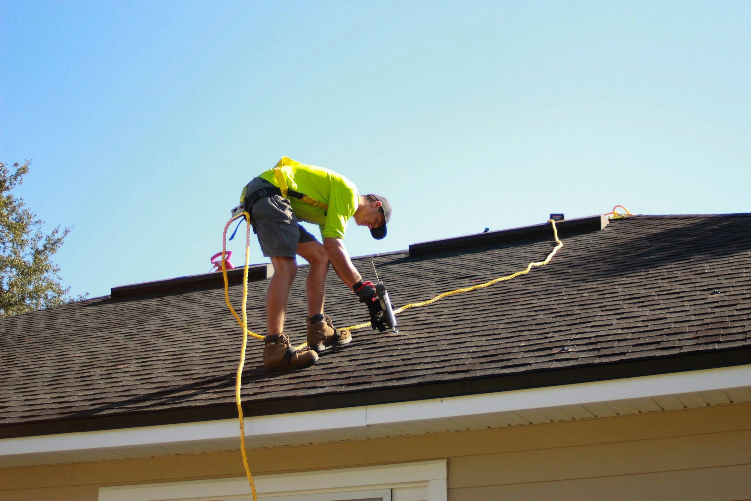 Completed residential roof with durable shingles, finished roof edges and clean exterior detailing